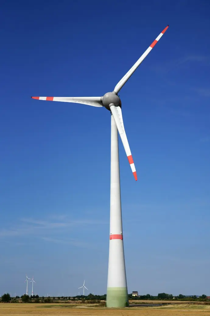 A wind turbine in the middle of a field